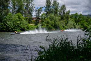 Boatnik, boats speed down the Rogue River in Grants Pass.