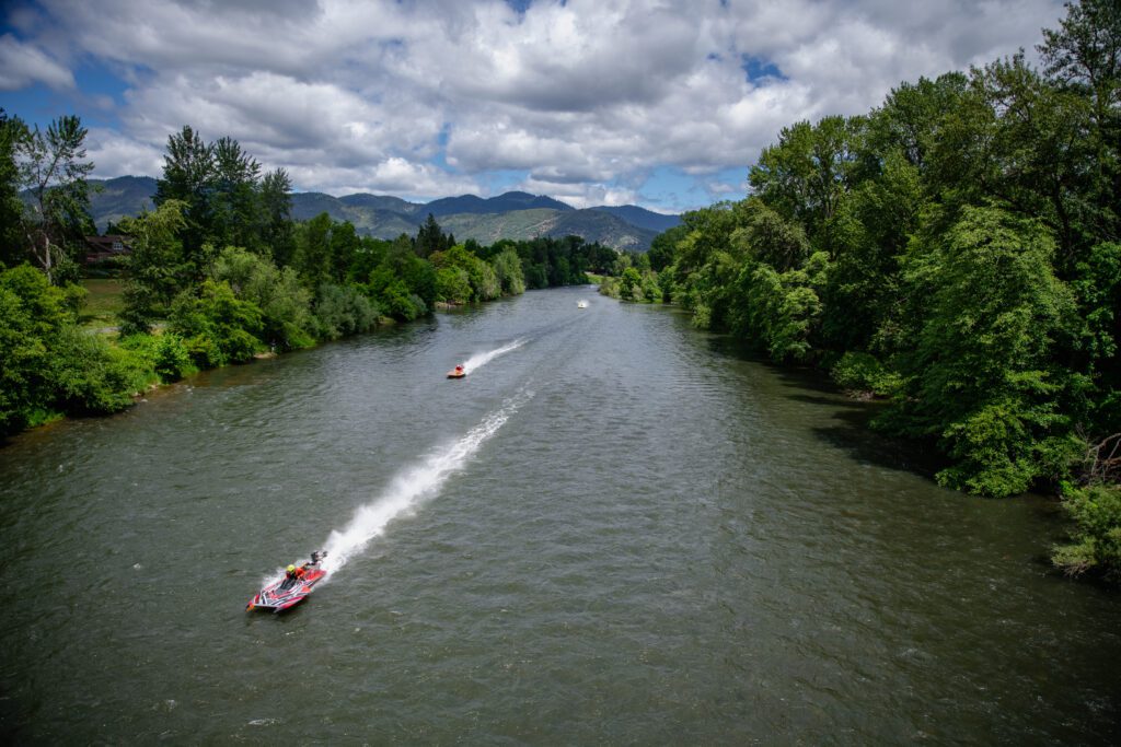 Boatnik, boats speed down the Rogue River in Grants Pass.