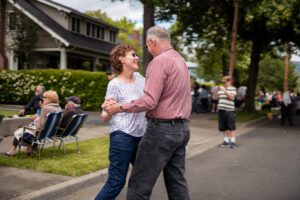 Couple dancing in the street while enjoying the live music at Porchfest, Grants Pass.