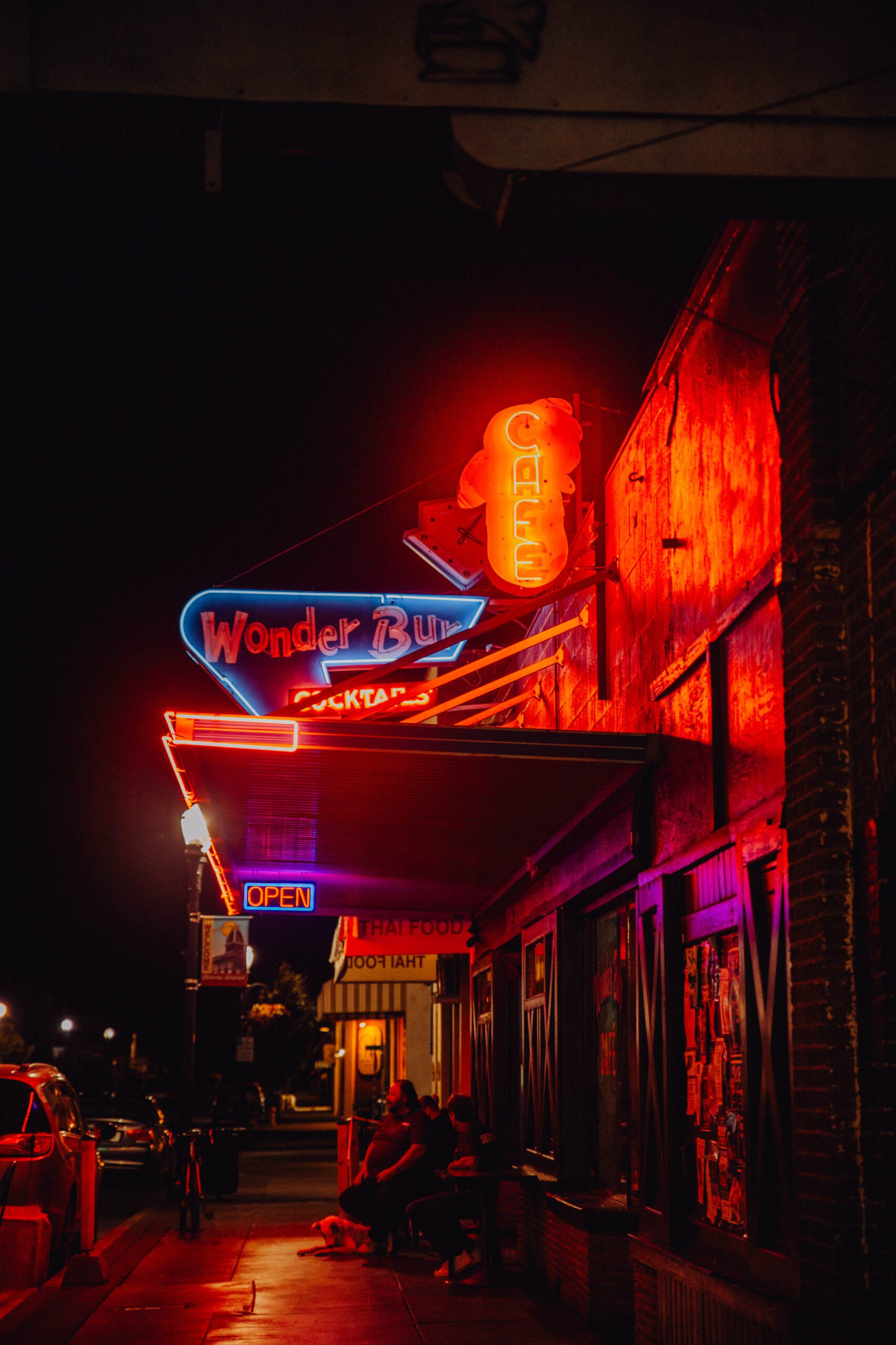 Wonder Bur neon sign lit up at night street view