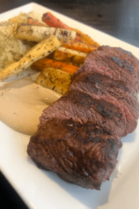 The Vine fine Dining sliced steak and grilled vegetables