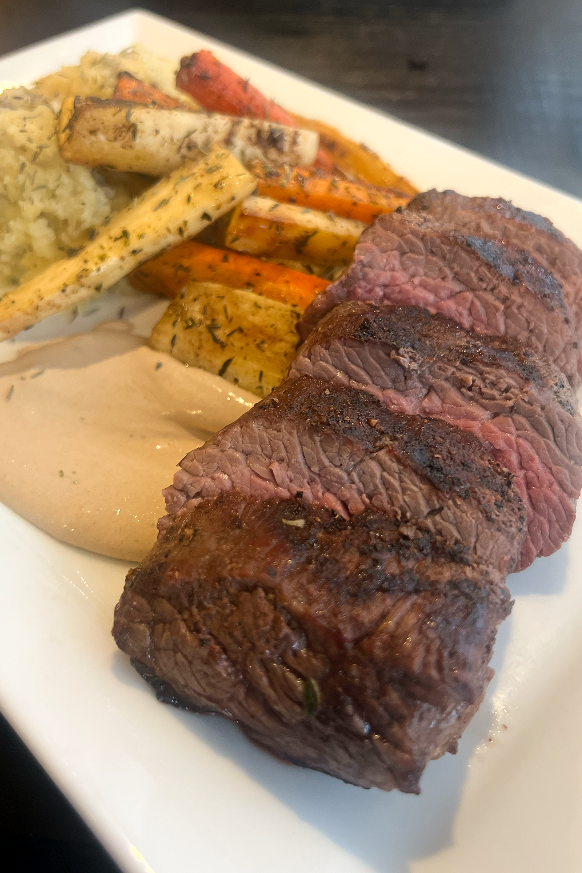 The Vine fine Dining sliced steak and grilled vegetables