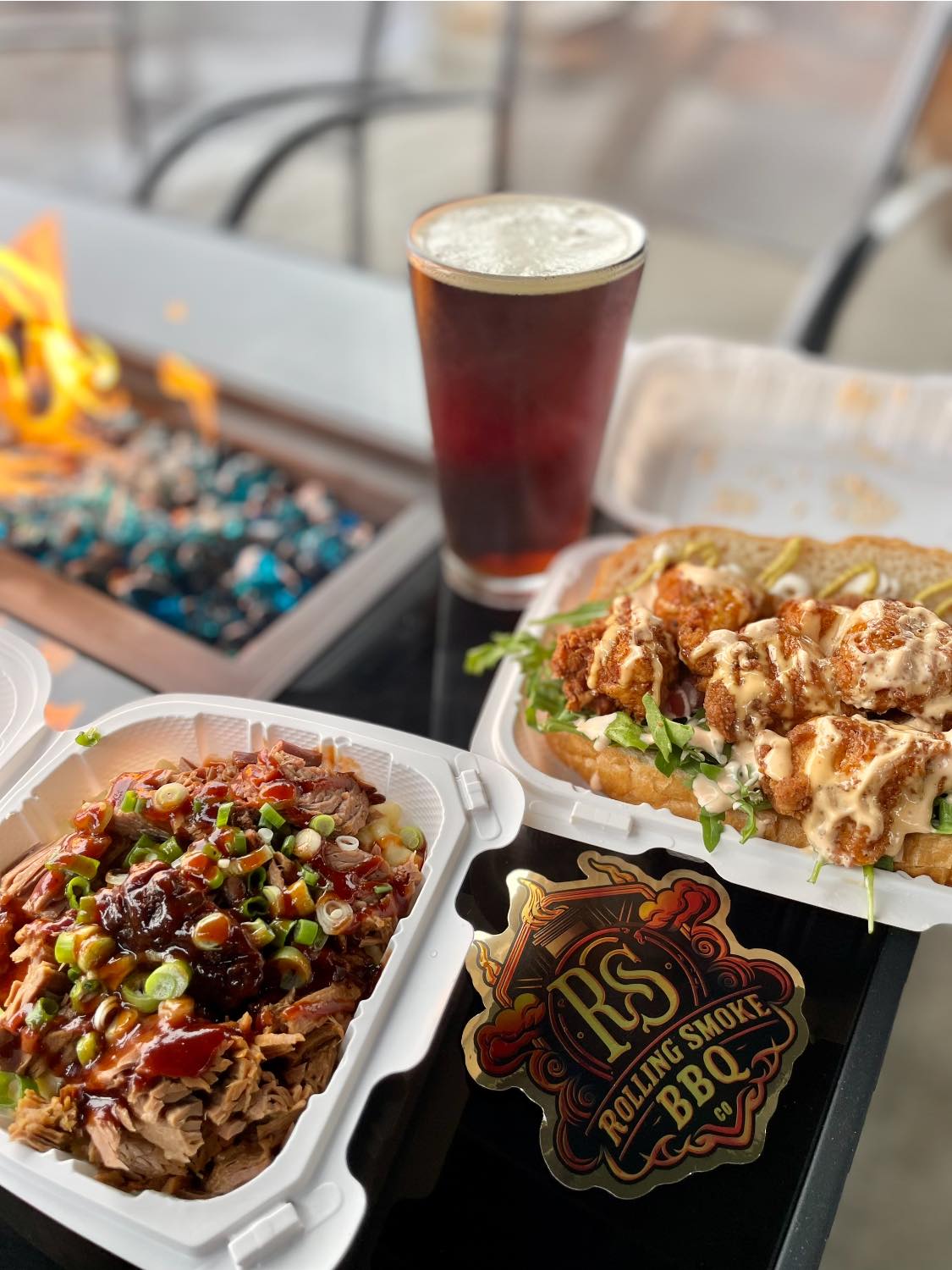 Area 61 food truck food and a beer by a fire pit