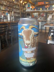 Horny Goat beer IPA in front of bar